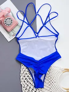 Blue one-piece swimsuit with cross straps and metal rings, stylish open back design.