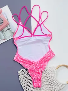 Detail view of hot pink leopard print monokini with multi-strap cross back design.