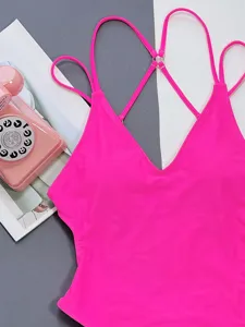 Hot pink one-piece swimsuit featuring sexy V-neck and delicate cross-back straps detail.