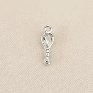 Close up of a silver spoon charm pendant with engraved letter detail, perfect for DIY jewelry.
