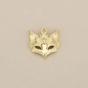Gold-plated fox mask pendant detail shot, exquisite filigree and crystal charm for DIY jewelry.