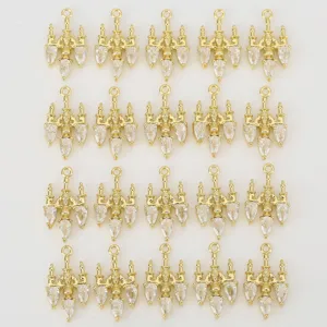 Close-up detail of gold plated chandelier pendants with crystal zirconia charms for DIY jewelry.