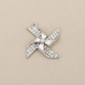 Detail shot of silver pinwheel pendant, exquisite pave cubic zirconia, stylish jewelry charm.