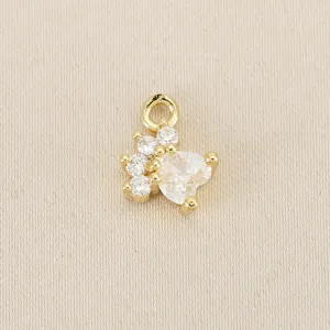 Detailed close-up of a gold-plated crystal pet cat paw charm pendant for DIY jewelry.