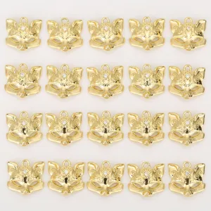 Gold plated fox mask charm pendant DIY jewelry accessory detailed shot with sparkling crystal.