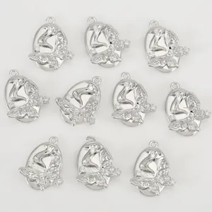 Silver-plated copper geometric relief butterfly pendant with sparkling cubic zirconia for DIY jewelry.