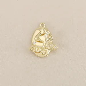 Close-up of 18k gold plated geometric butterfly pendant with sparkling zircon details.