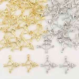 Detailed view of exquisite bow and arrow shaped charms inlaid with sparkling cubic zirconia crystals.