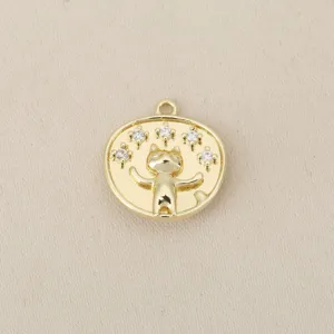 Closeup detail of 18k gold plated lucky cat round pendant charm, sparkling cubic zirconia settings.
