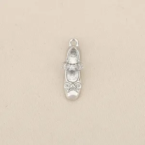 Silver ballet shoe pendant with sparkling cubic zirconia and bow, ideal for DIY jewelry making.
