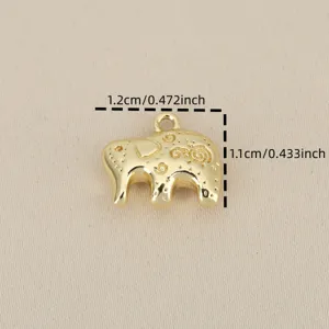 Close-up detail of the gold-plated elephant pendant charm with delicate engraved texture patterns.