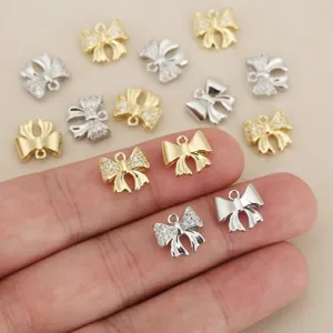 Ciondoli fiocco zircone oro e argento accessori gioielli DIY vista dettagliata