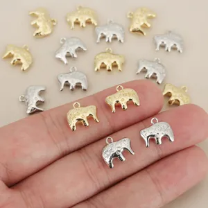 Gold and silver elephant charms with detailed patterns, perfect for DIY jewelry making accessories.