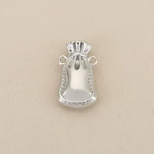 Detailed shot of silver lucky bag pendant, intricate rope pattern DIY jewelry accessory.