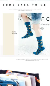 Detailed view of trendy salmon sushi patterned mid-calf socks, stylish casual footwear for daily wear.