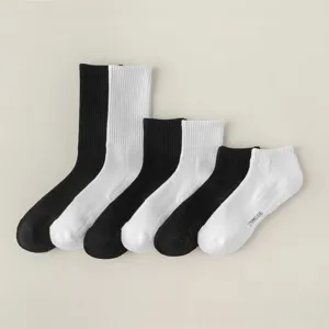 Classic black and white cotton athletic socks set in multiple lengths for daily sports wear.