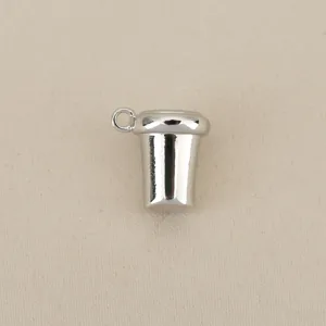 Silver-tone metal cup pendant detail, perfect DIY jewelry accessory for creative crafting.