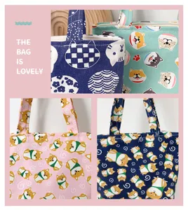 Cute cartoon dog and cat print canvas tote bag, portable casual bento handbag for daily use.