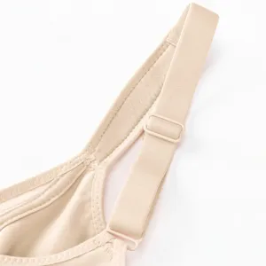 Close-up detail of women's seamless bra strap with adjustable slider, smooth nude design.