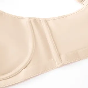 Close-up of nude seamless bra side band detail, showing fine stitching and supportive structure.