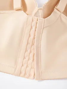 Detailed view of women plus size front closure push up bra beige intimate apparel close up