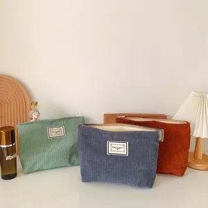 Solid color simple corduroy makeup bag portable travel zipper storage pouch for toiletries.