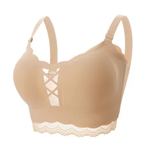 Seamless nude push up bra with criss cross front and lace trim, comfortable wireless design.