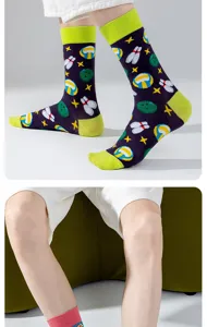 Trendy athletic mid-calf socks featuring bowling and volleyball patterns with green heels.