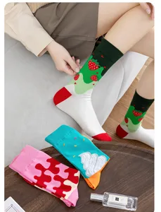 Detail view of cute dopamine strawberry and ice cream fashion mid-tube socks on model.