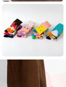 Close-up detail of colorful dopamine style mid-tube socks with cute ice cream and cherry patterns.