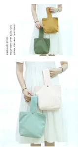 Detailed view of portable canvas cup cover and mini handbag, solid color design with snap.