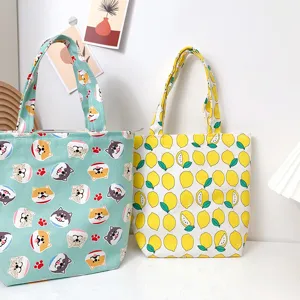 Canvas bento tote bag featuring cute cartoon dog and fresh lemon prints for daily portable use.