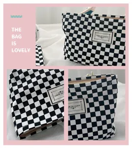 Black and white checkerboard cosmetic bag, minimalist canvas portable makeup storage pouch.