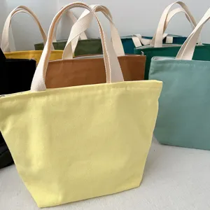 Detailed shot of colorful canvas lunch tote bag with durable handles and secure zipper closure.