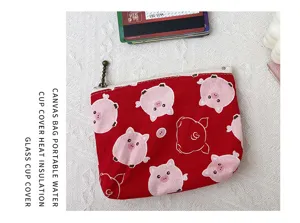 Niedliche rote Canvas-Münzbörse mit süßem rosa Schweinchen-Druck und praktischem Reißverschluss.