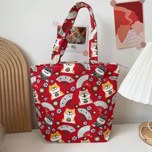 Red canvas tote bag with cute Shiba Inu dog pattern, portable lunch bag for daily use.