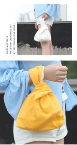 Canvas knot bag wrist bag detail view, casual Japanese style portable small storage bag close up.