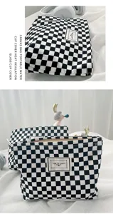 Black white checkerboard canvas cosmetic bag, minimalist square portable storage pouch detail.