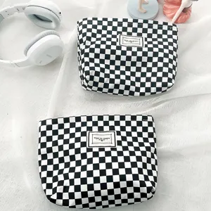 Black and white checkerboard cosmetic bag, minimalist square canvas portable makeup pouch for use.