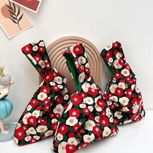 Japanese style floral knot fabric wrist bag portable mini handbag for daily use keys and phone.