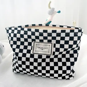 Black and white checkerboard cosmetic bag, fashion simple square canvas portable storage pouch.