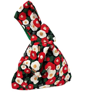 Japanese fabric knot wrist bag with floral print, casual cotton handheld purse for phone and keys.