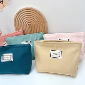 Borsa cosmetica in tela colore caramella minimalista cerniera custodia dettaglio