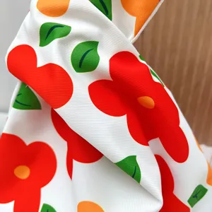 Japanese style floral canvas wrist bag detail, cute red flower print fabric handbag.
