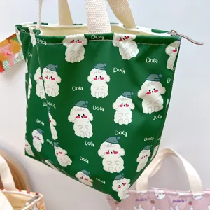 Grüne süße Cartoon-Hund-Druck wasserdichte Lunchtasche mit Henkeln und sicherem Reißverschluss.