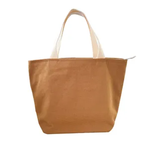 Brown canvas lunch bag with sturdy handles and zipper closure for daily office workers use.
