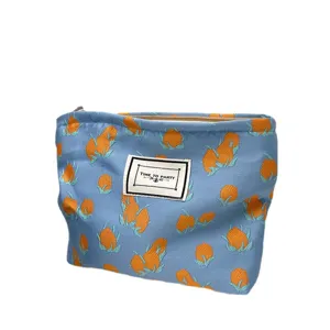 Floral cosmetic bag for women, stylish portable travel makeup pouch, zipper toiletry organizer.