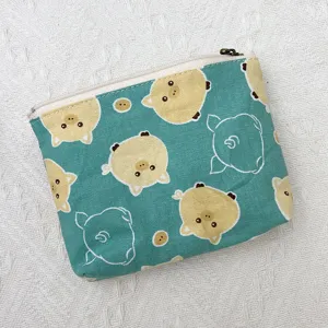 Niedliche türkise Segeltuch-Münzbörse Detail, süßes Schweinchen-Muster, kleines Etui.