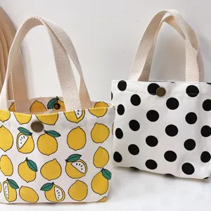 Cute cartoon lemon and polka dot canvas tote bag, portable small handbag for daily use.