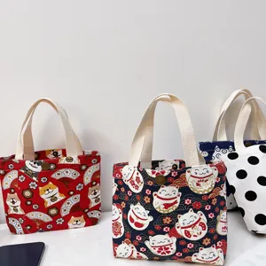 Cute cartoon canvas tote bag detail, featuring durable fabric, sturdy handles and snap closure.